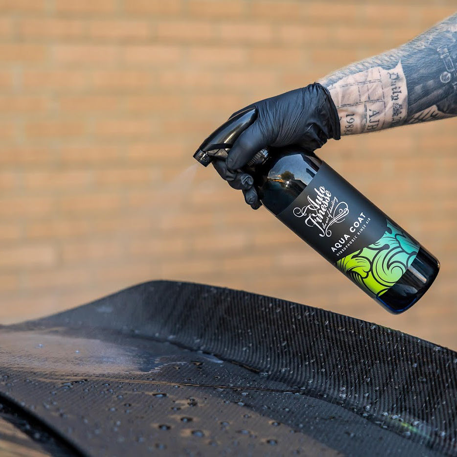 Aqua Coat Rinse Aid Being Sprayed onto Wet Vehicle