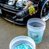 Lather Car Shampoo Being Added To Bucket