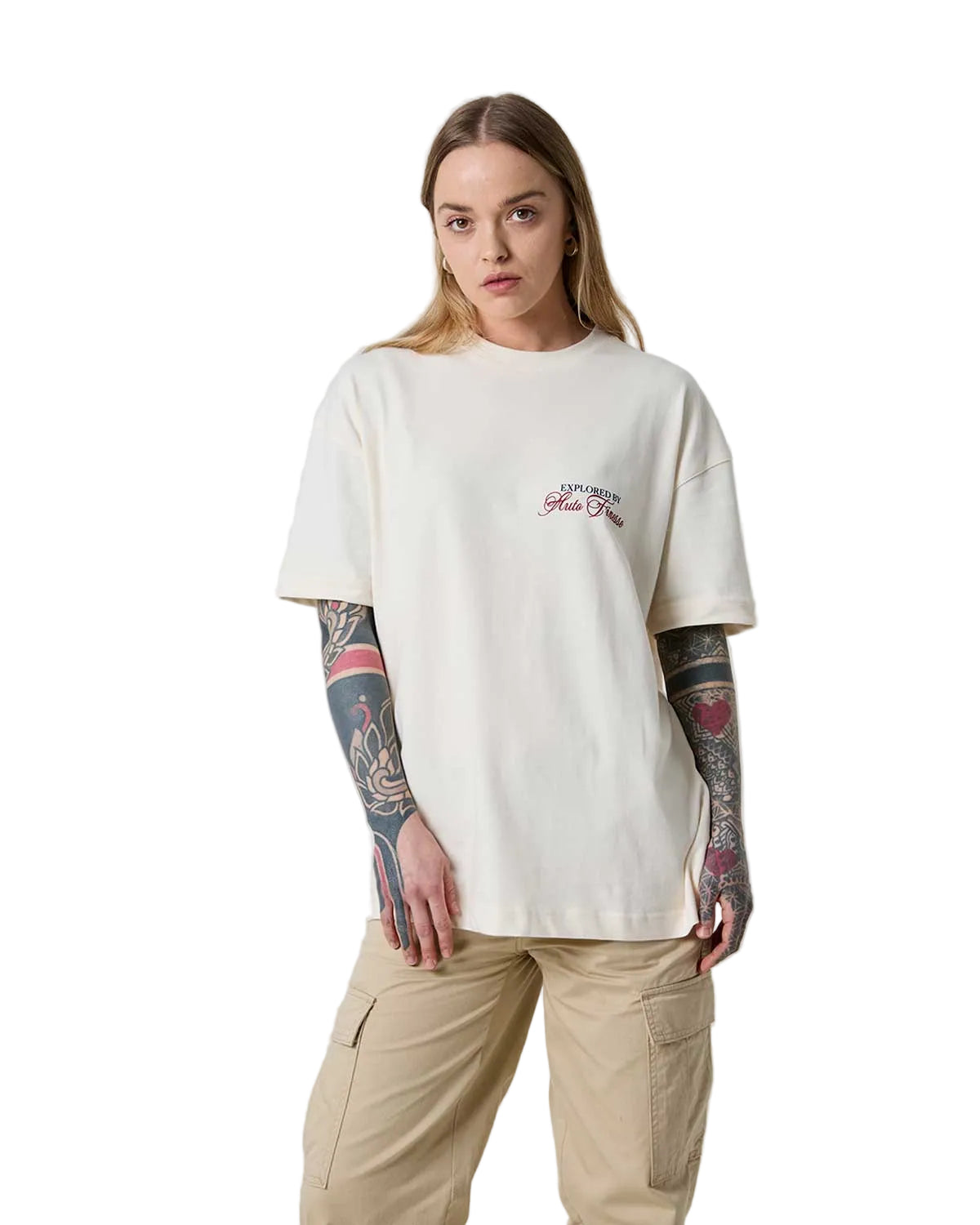 Person wearing a white t-shirt with a logo on a plain background