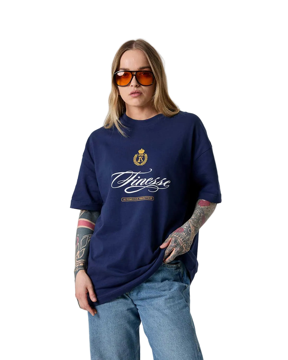 Person wearing a navy blue t-shirt with a logo and text, sunglasses, and jeans on a light gray background