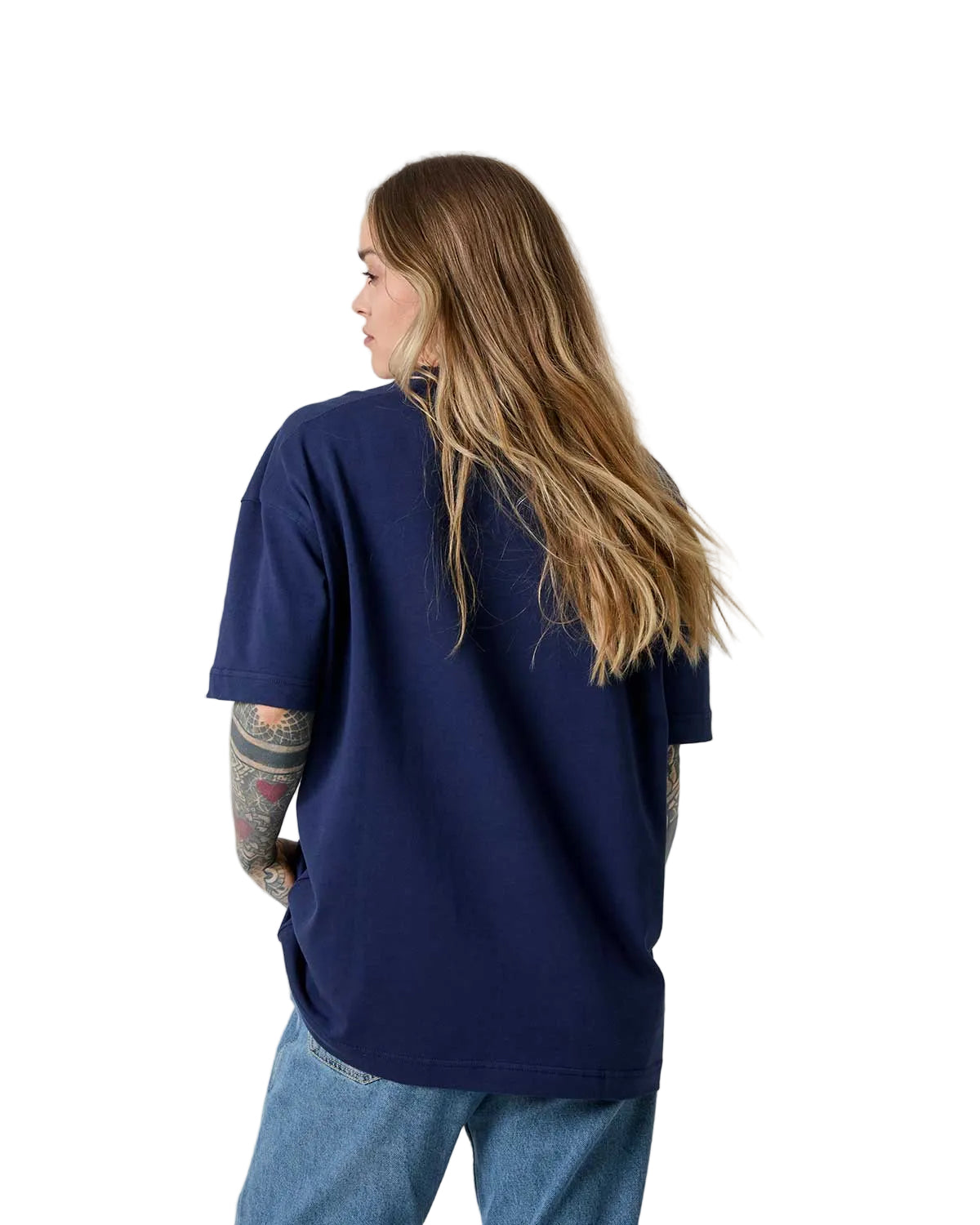 Person wearing a navy blue t-shirt and jeans on a plain background