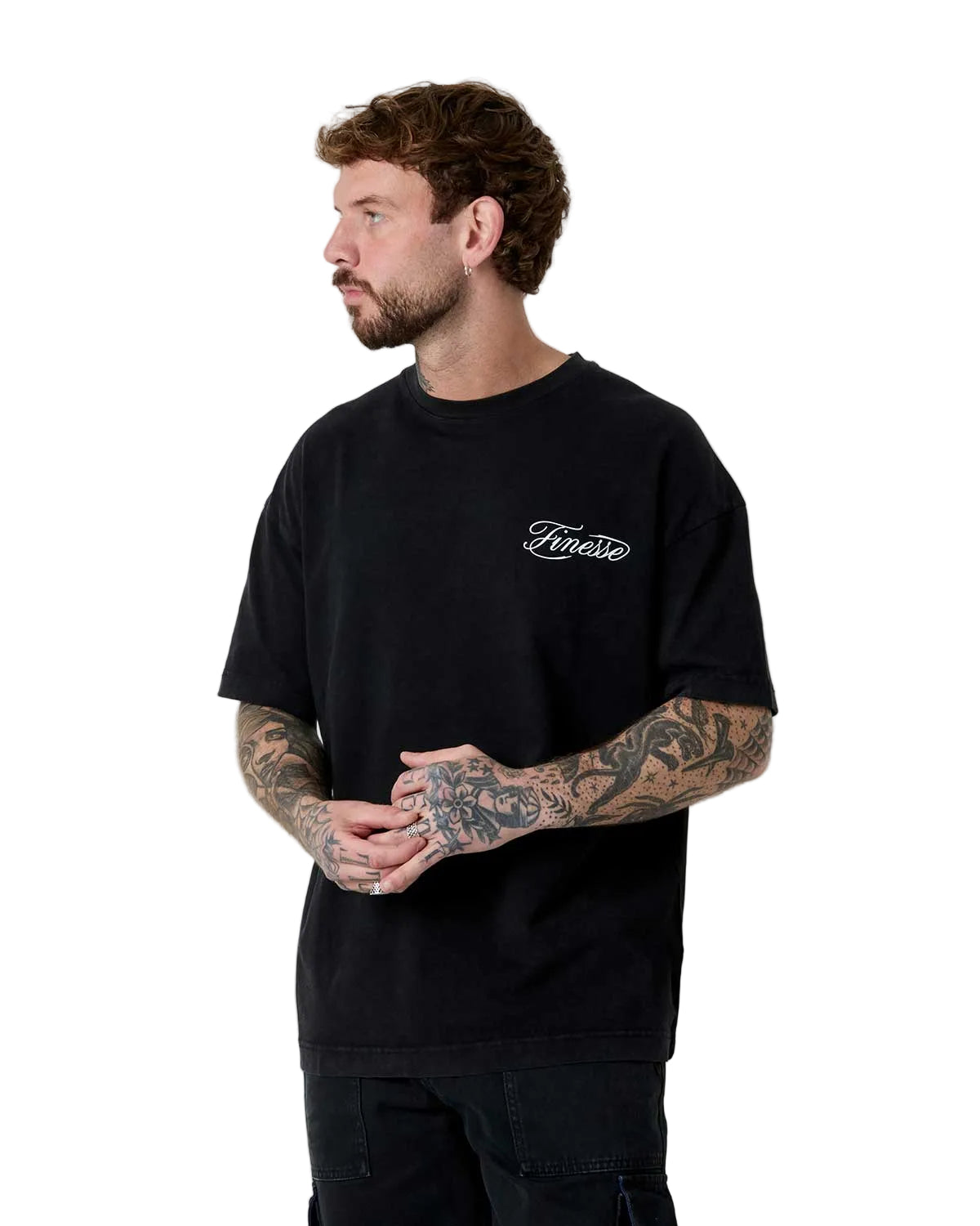 Man wearing a black t-shirt with white text on a plain background