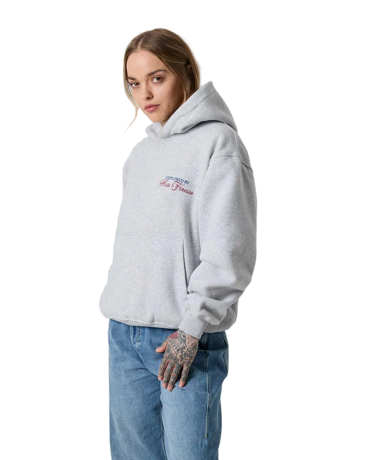 Person wearing a gray hoodie with a logo on a white background