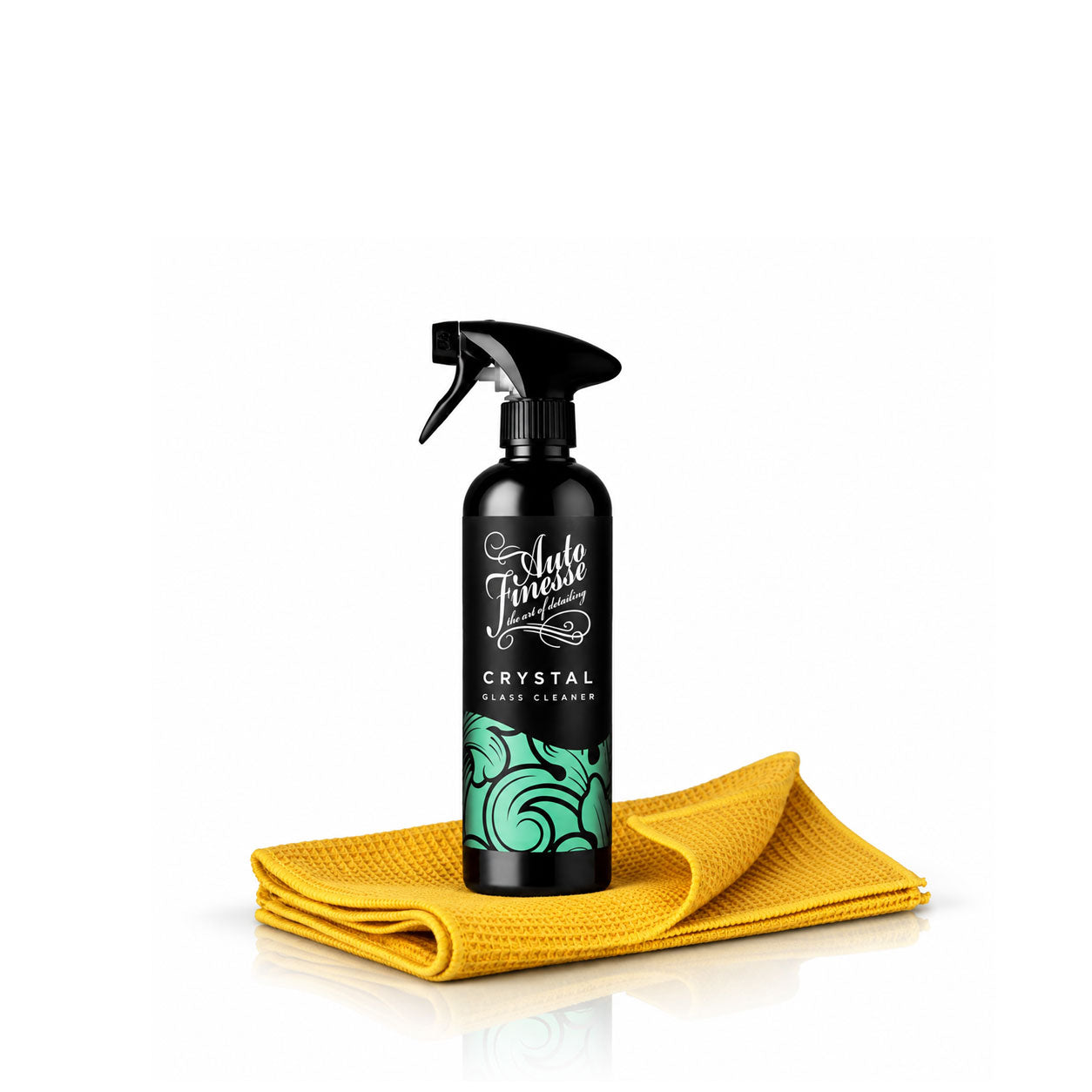A black spray bottle of Auto Finish Crystal Shine Coated liquid cleaner, displayed on top of a folded yellow microfiber cloth against a white background.