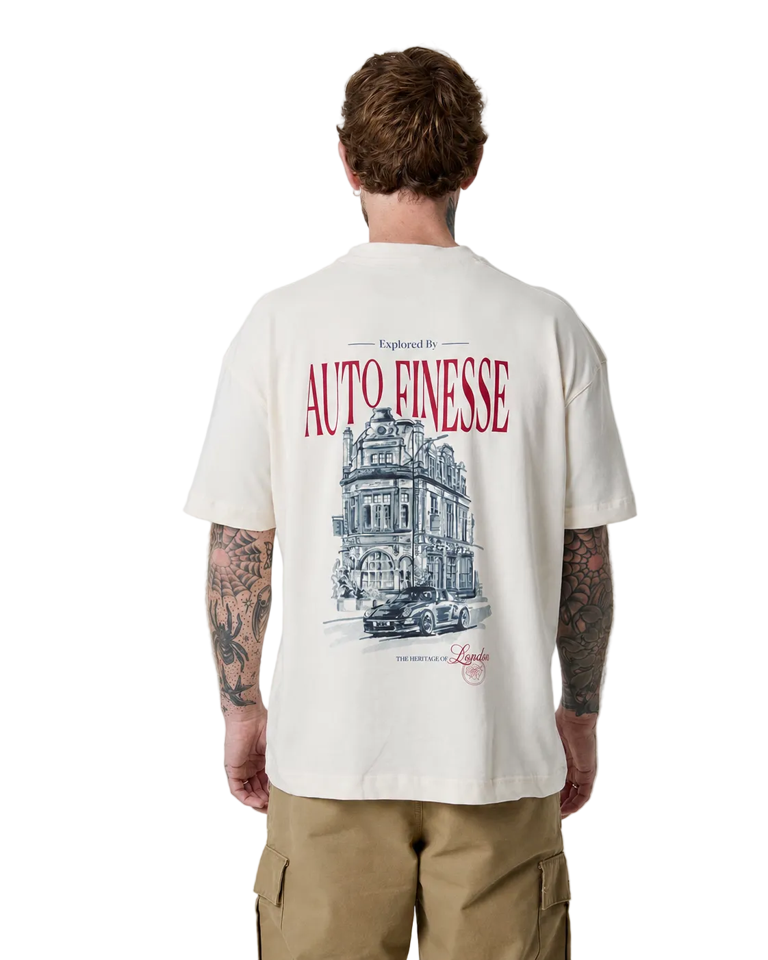 Man wearing a cream t-shirt with a graphic design and text on the back