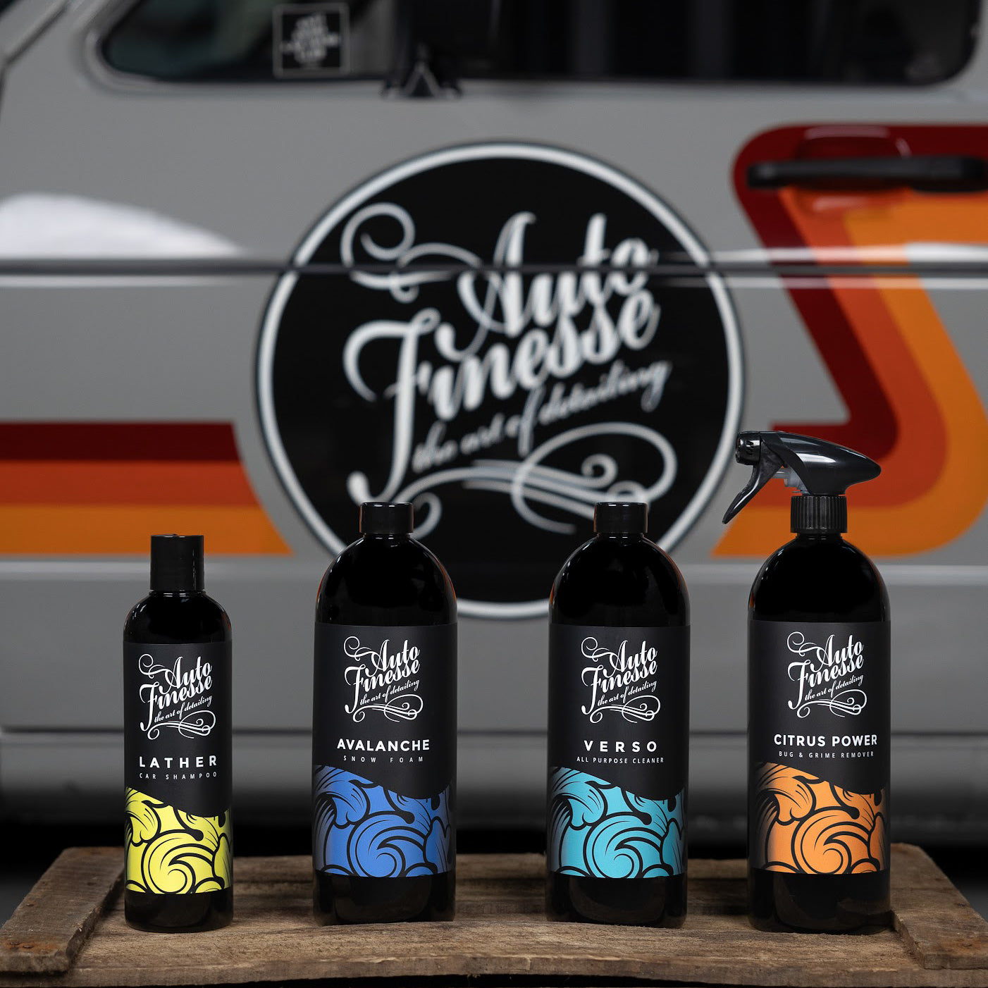 Car washing products on display with a vintage car_ Connoisseurs Kit
