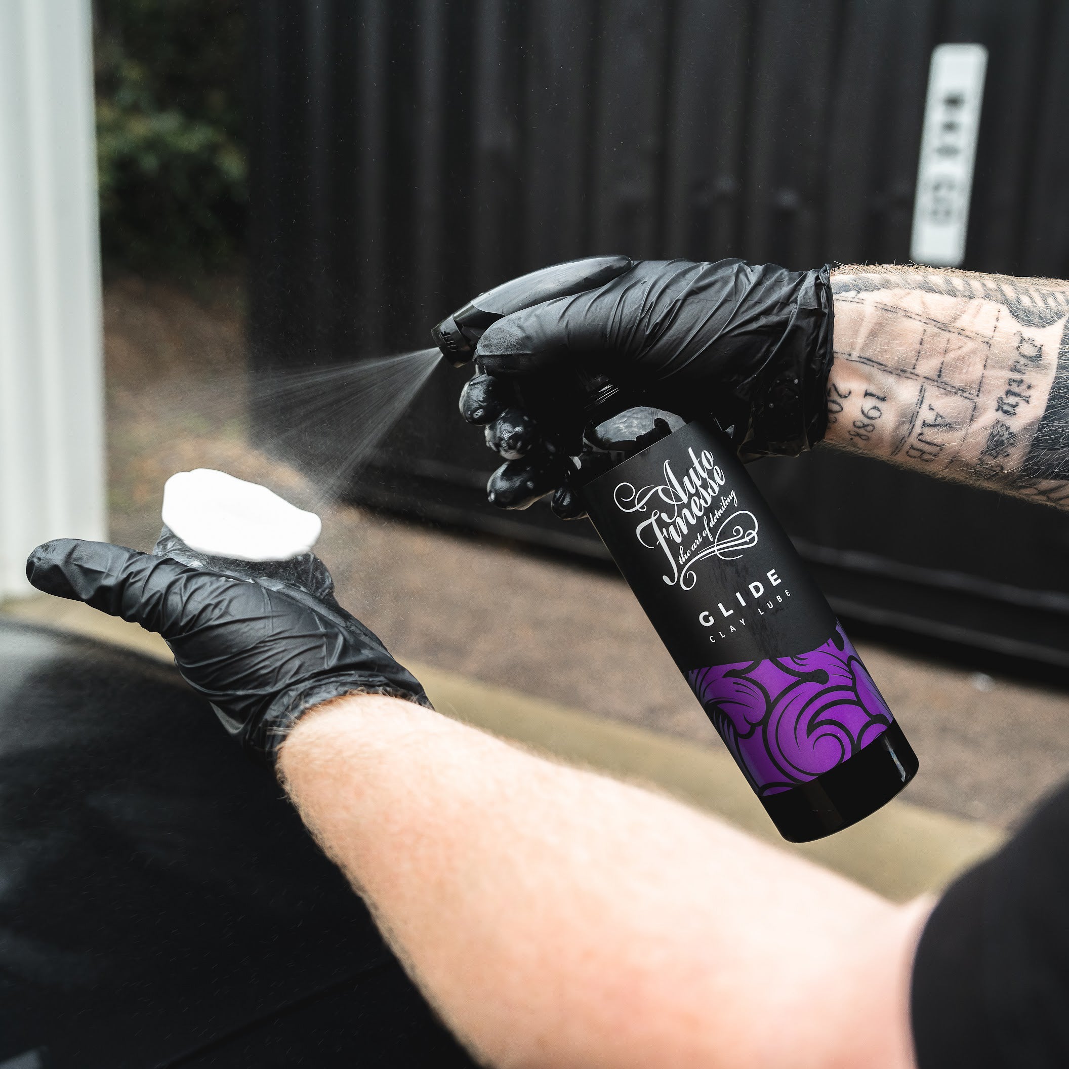 Spraying Glide Clay Lube on Clay Bar_ Decontamination Kit