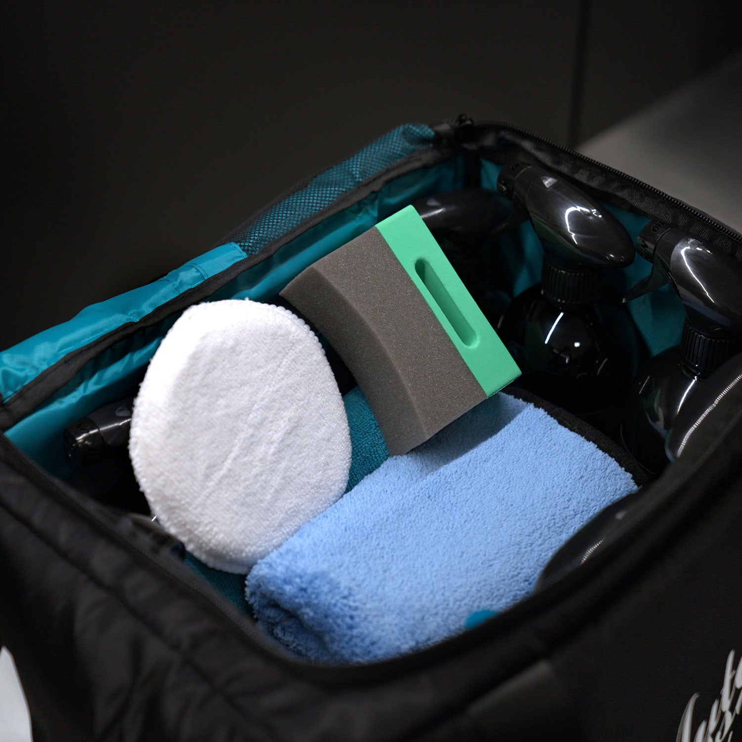 Inside the Auto Finesse Detailers Kit Bag with cleaning products