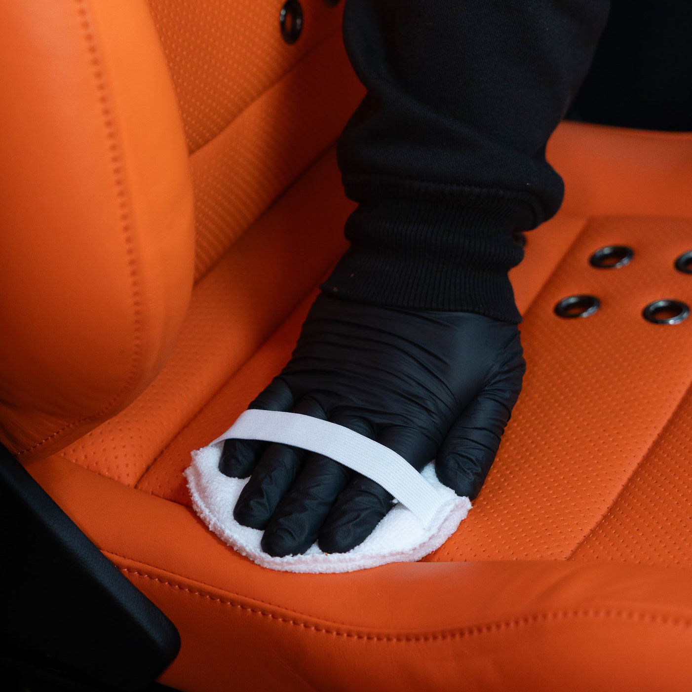 Applying Hide leather conditioner with a applicator_ Leather Cleaning Kit