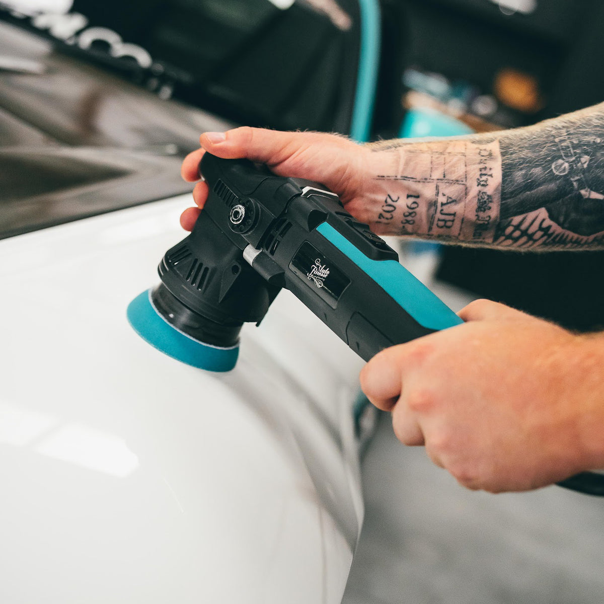 Machine polishing vehicle paint to remove defects