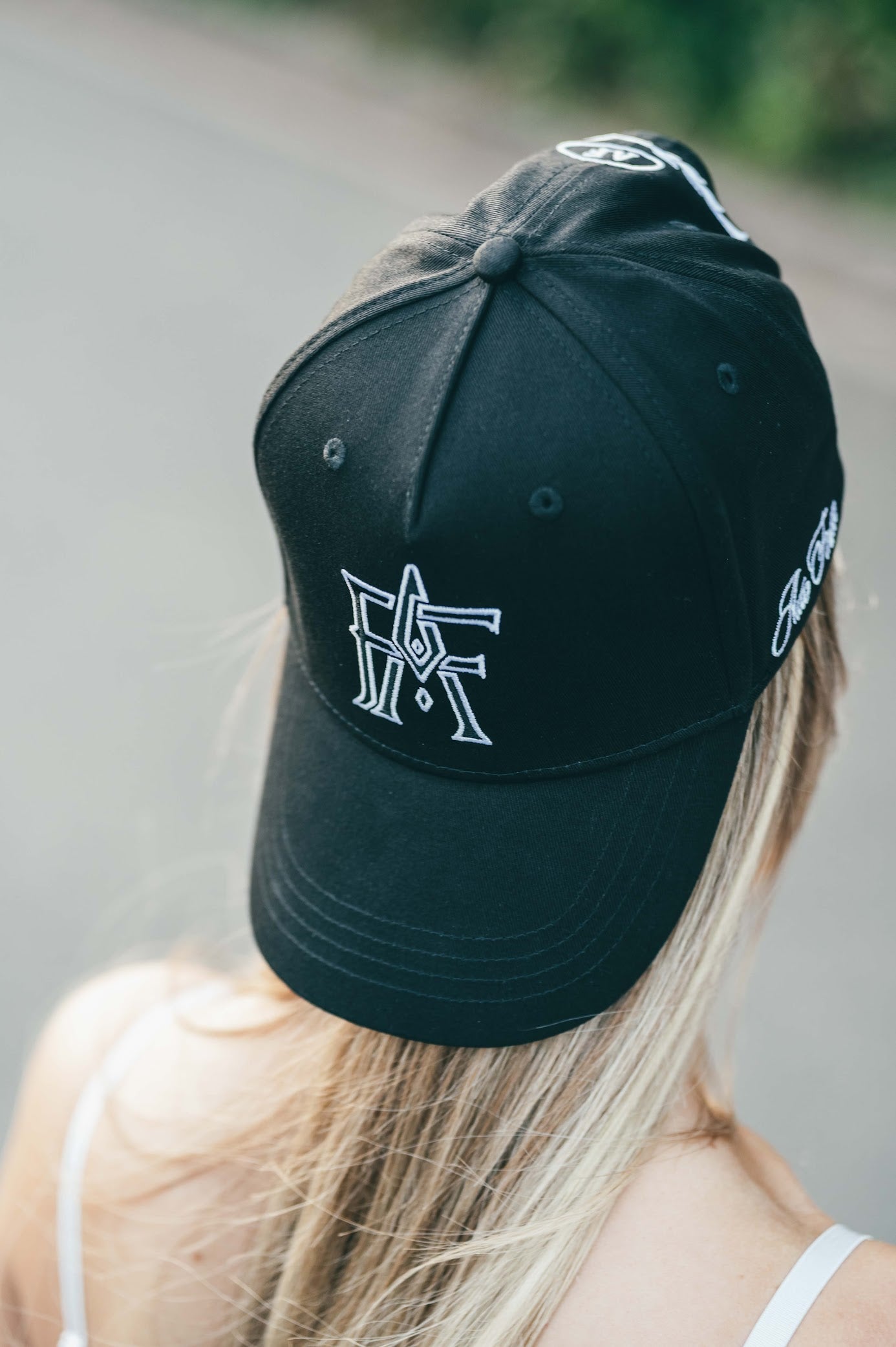 Monogram cap – close-up of stitched Auto Finesse detailing