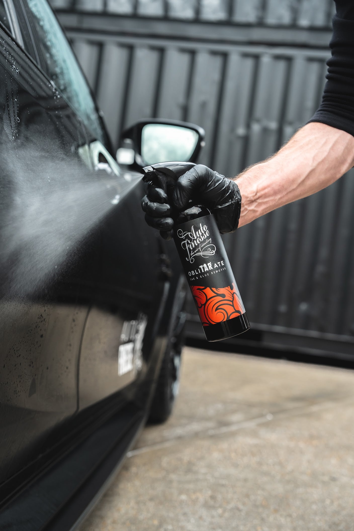 Spraying ObliTARate on Car_ Decontamination Kit