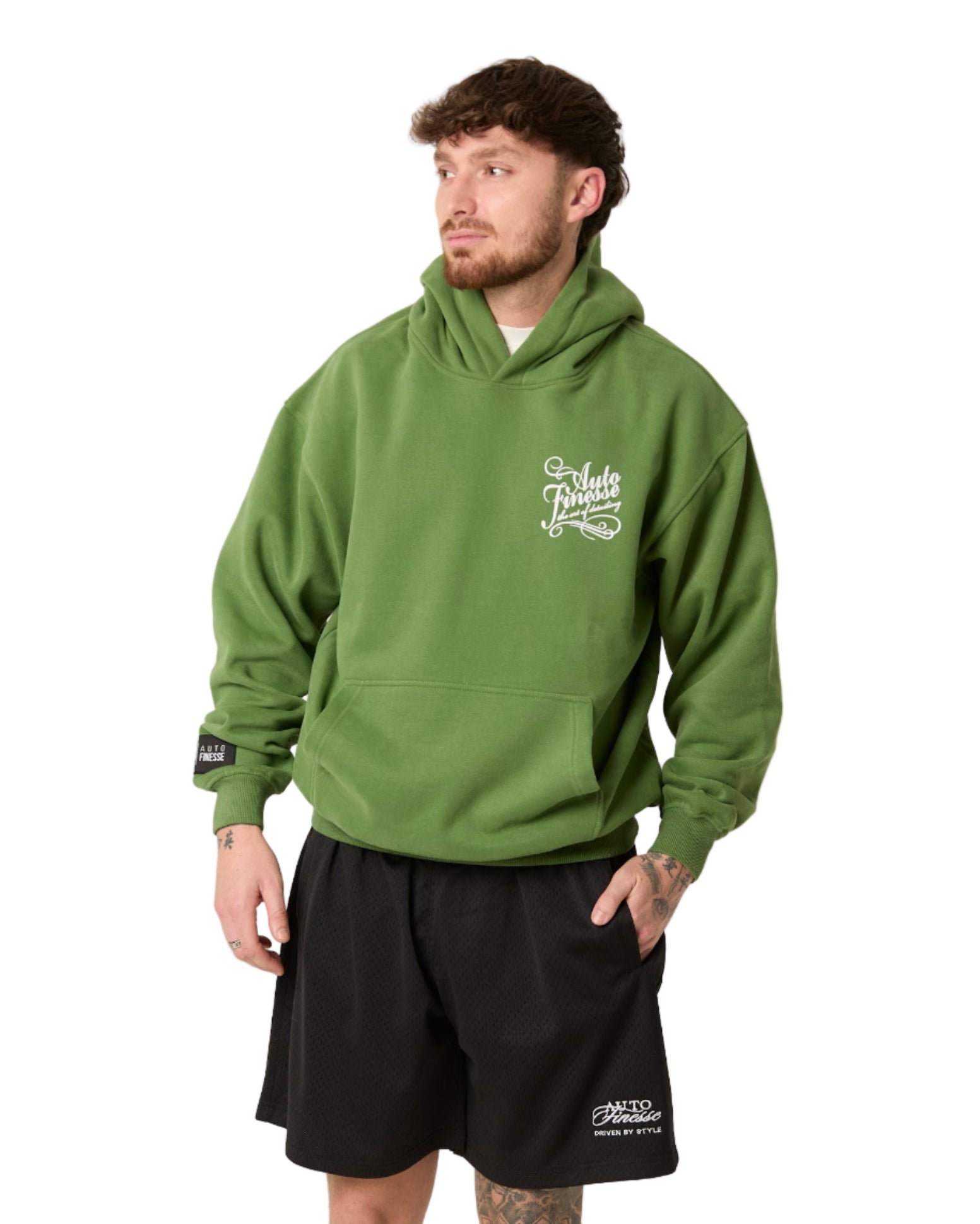 Man wearing a green hoodie with a logo on a white background