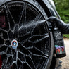 Reactive Wheel Cleaner Sprayed Onto Wheel Square