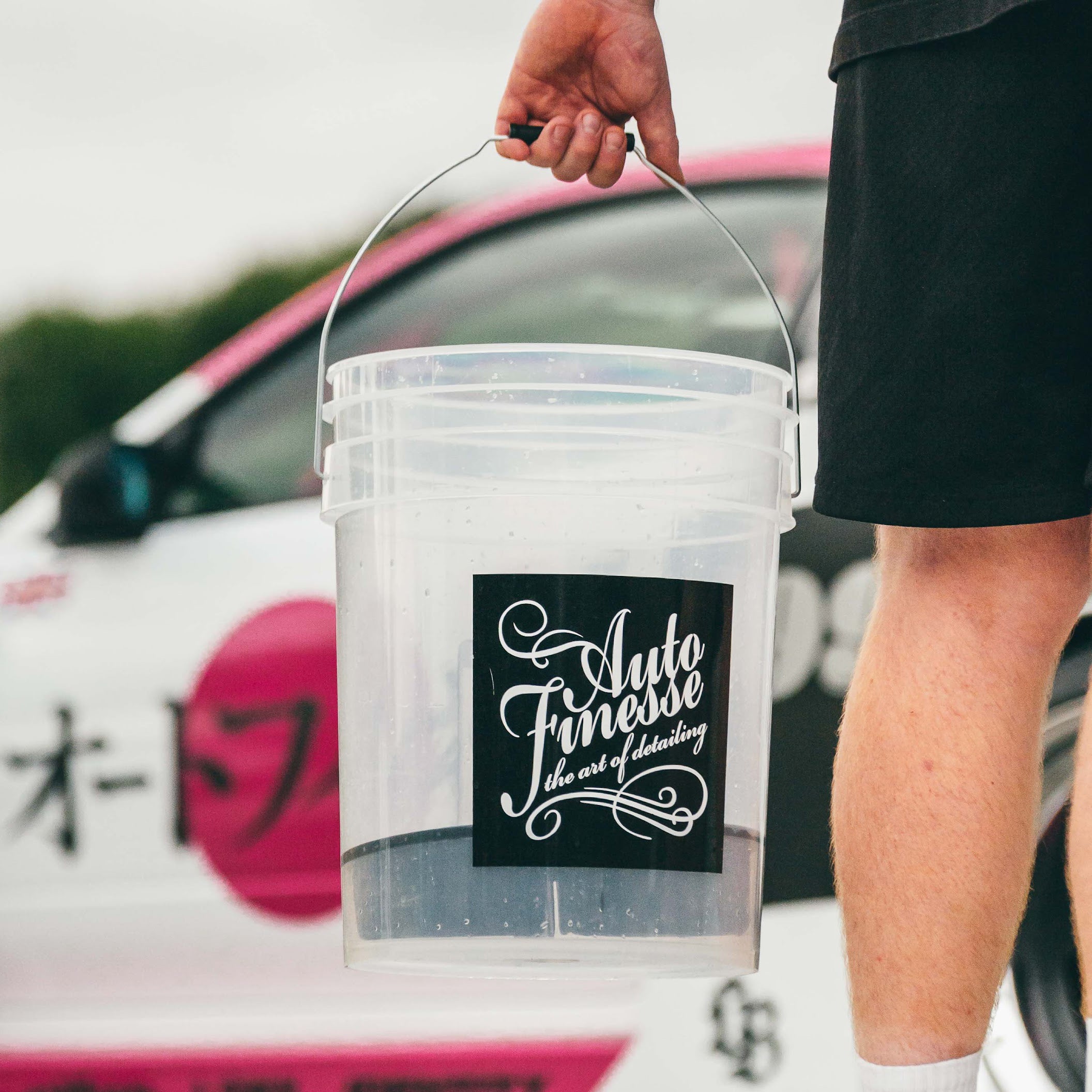 Clear 20L car detailing bucket with dirt guard