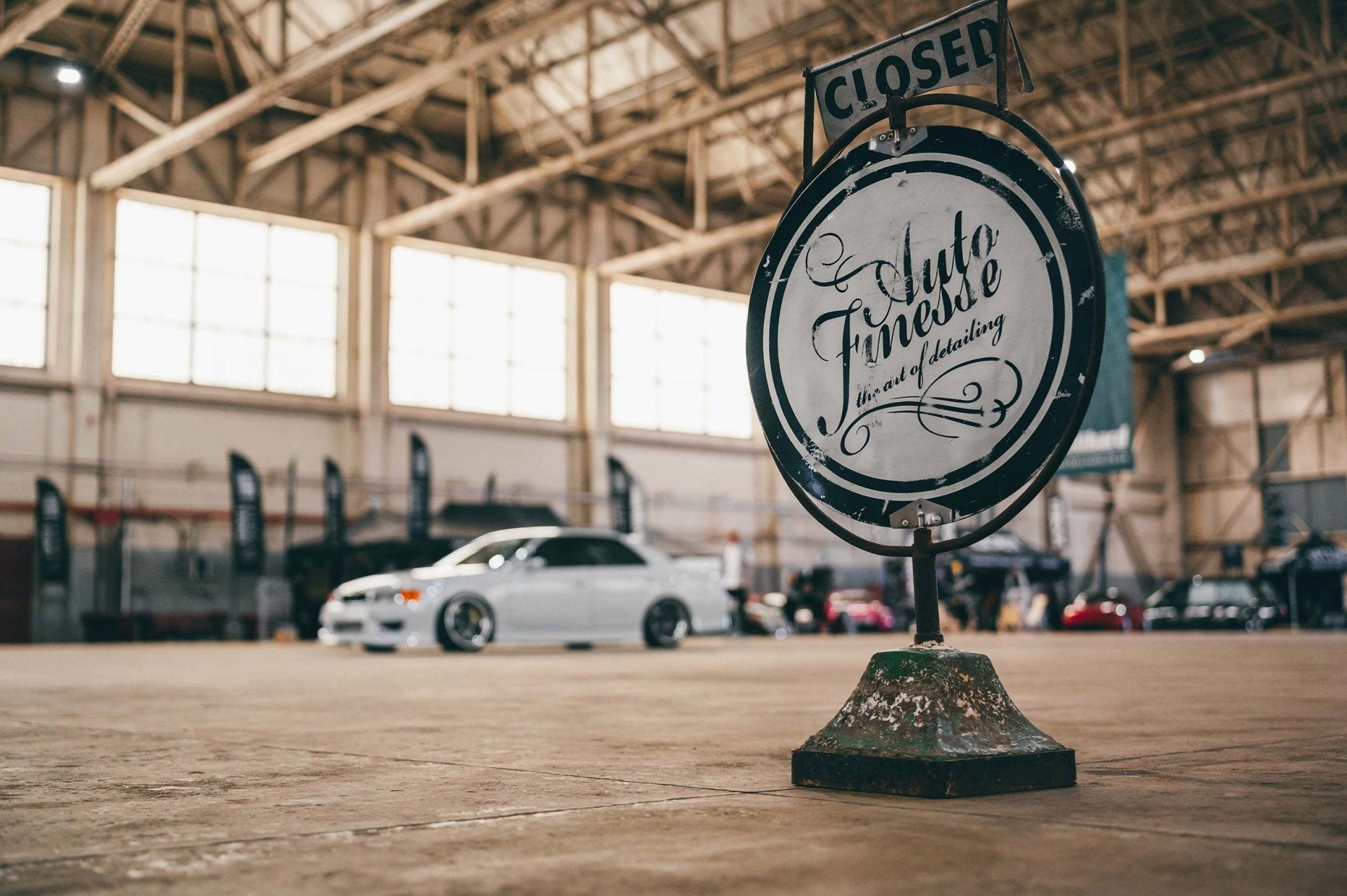 Auto Finesse sign at car event