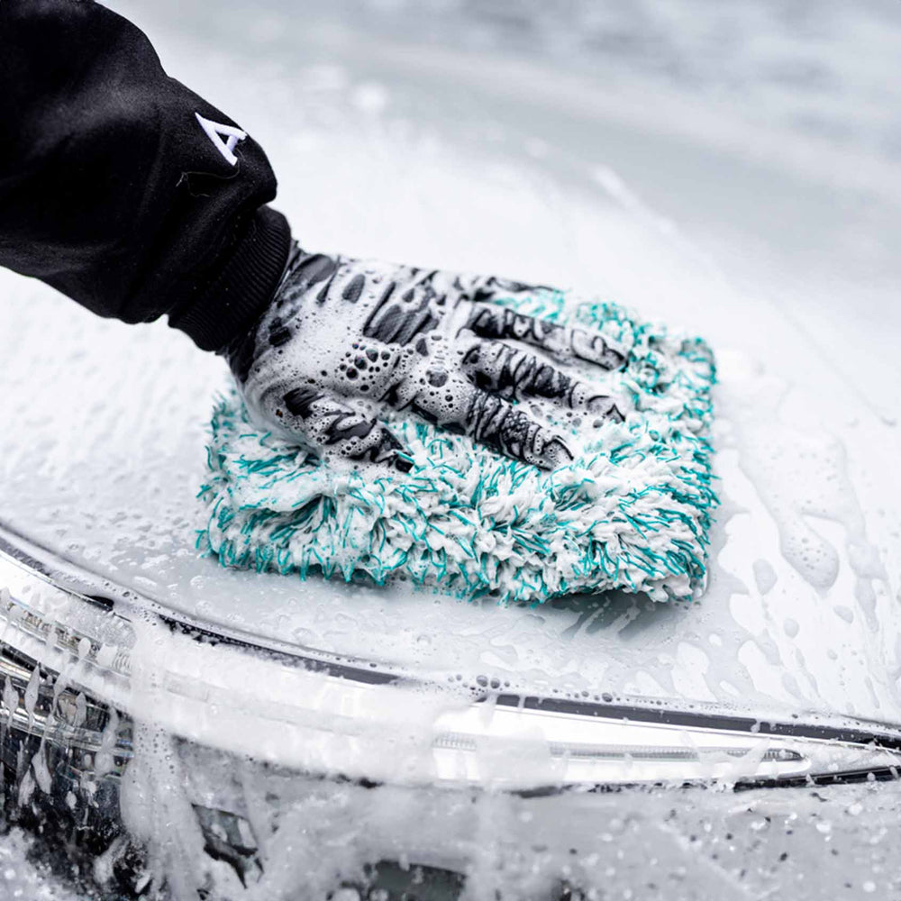 Man washing car with Cherry Blossom Car Shampoo and wash mitt