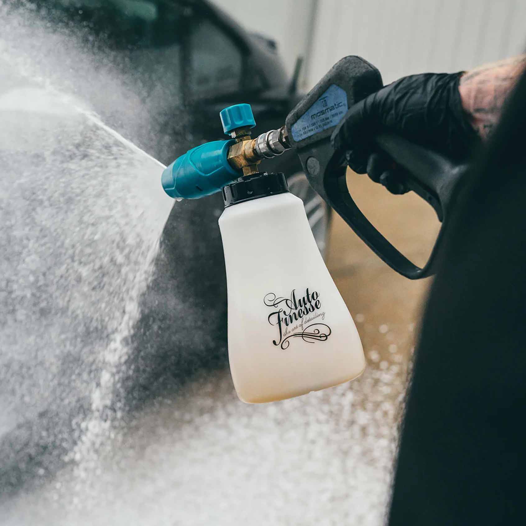 The Core Wash Kit - Spraying snow foam on the car