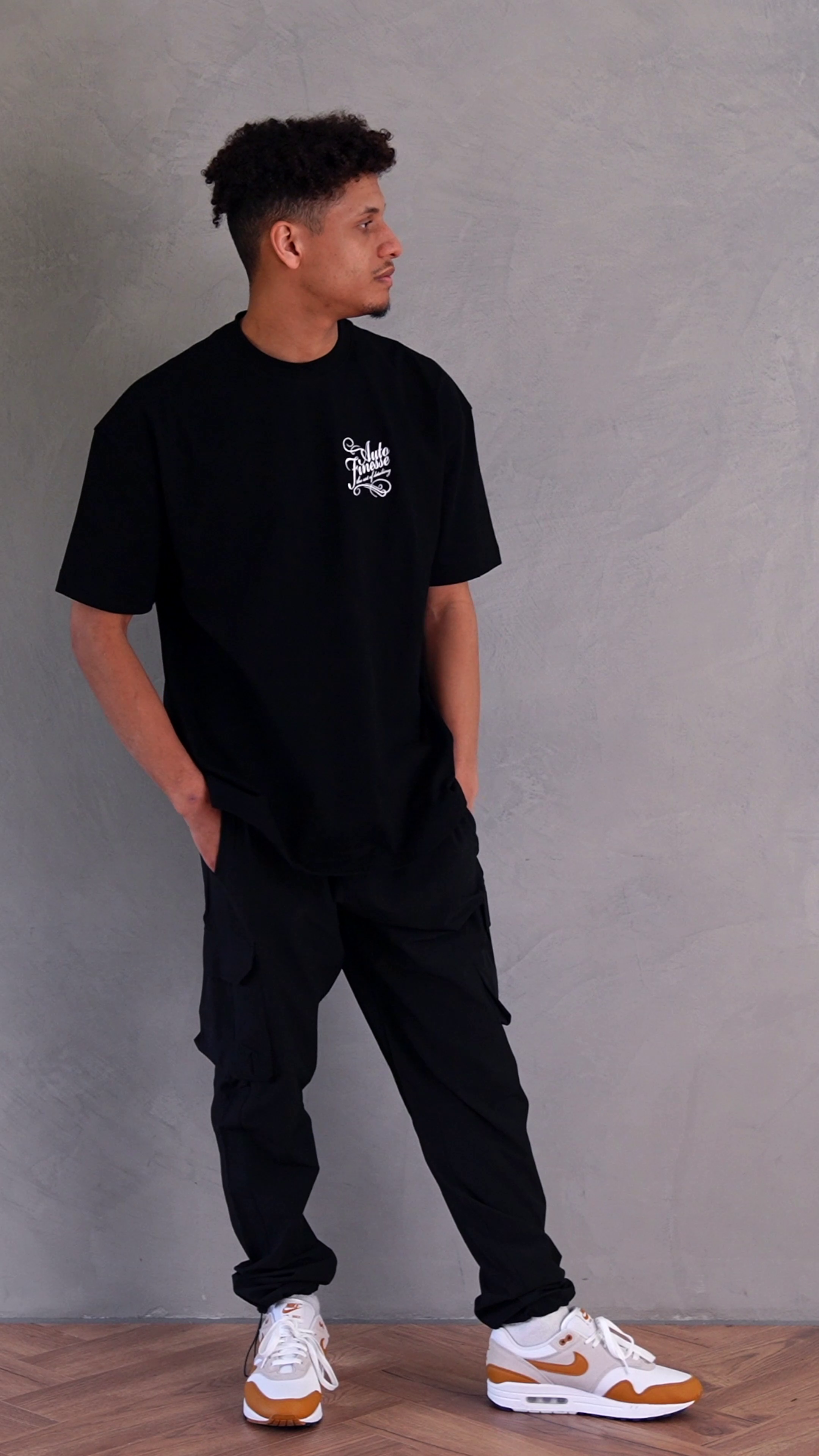 Signature Tee - Black T-Shirt_ Man Wearing