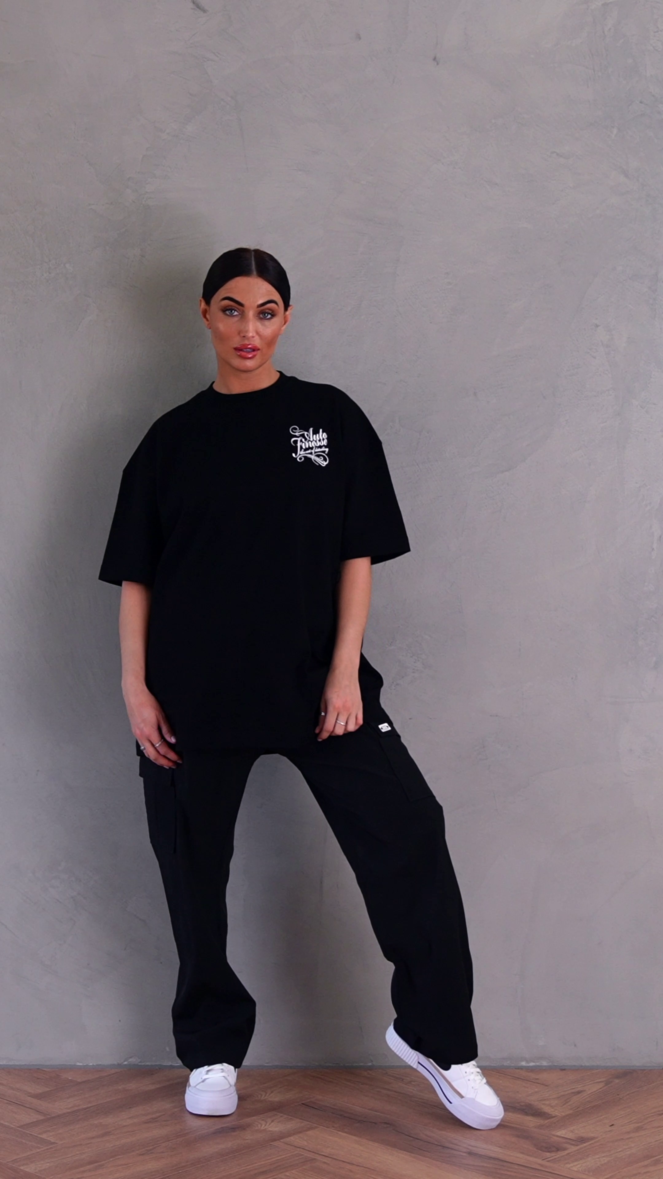 Signature Tee - Black T-Shirt_ Woman Wearing