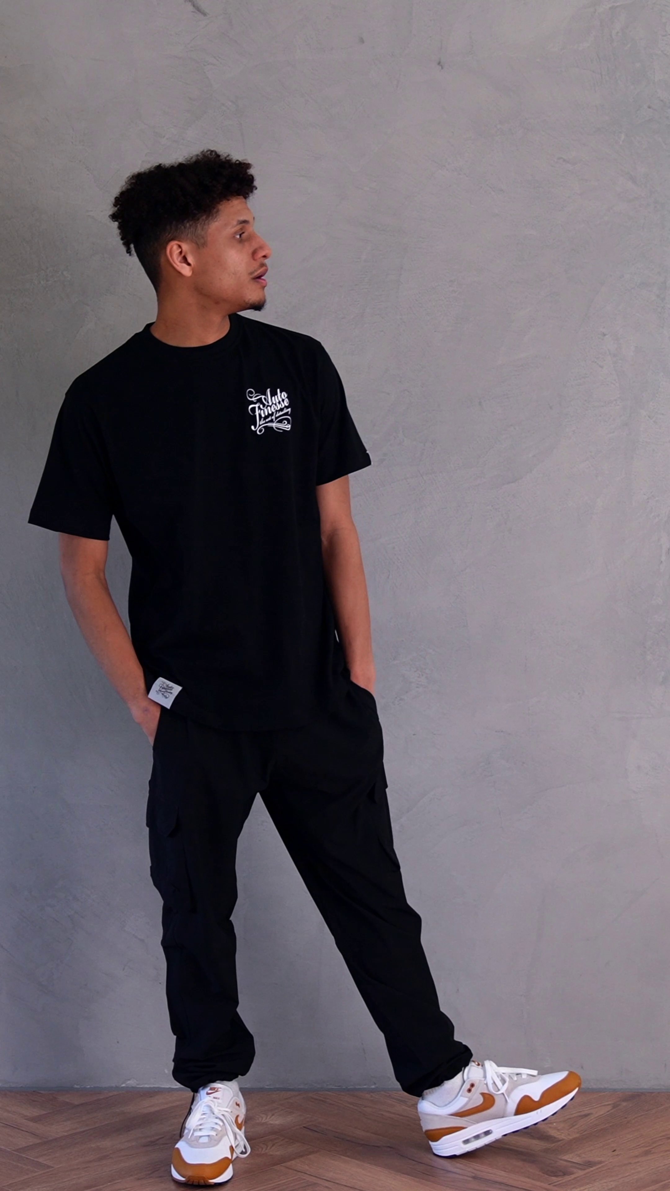 Detailers Signature T-Shirt Black_ Man Wearing