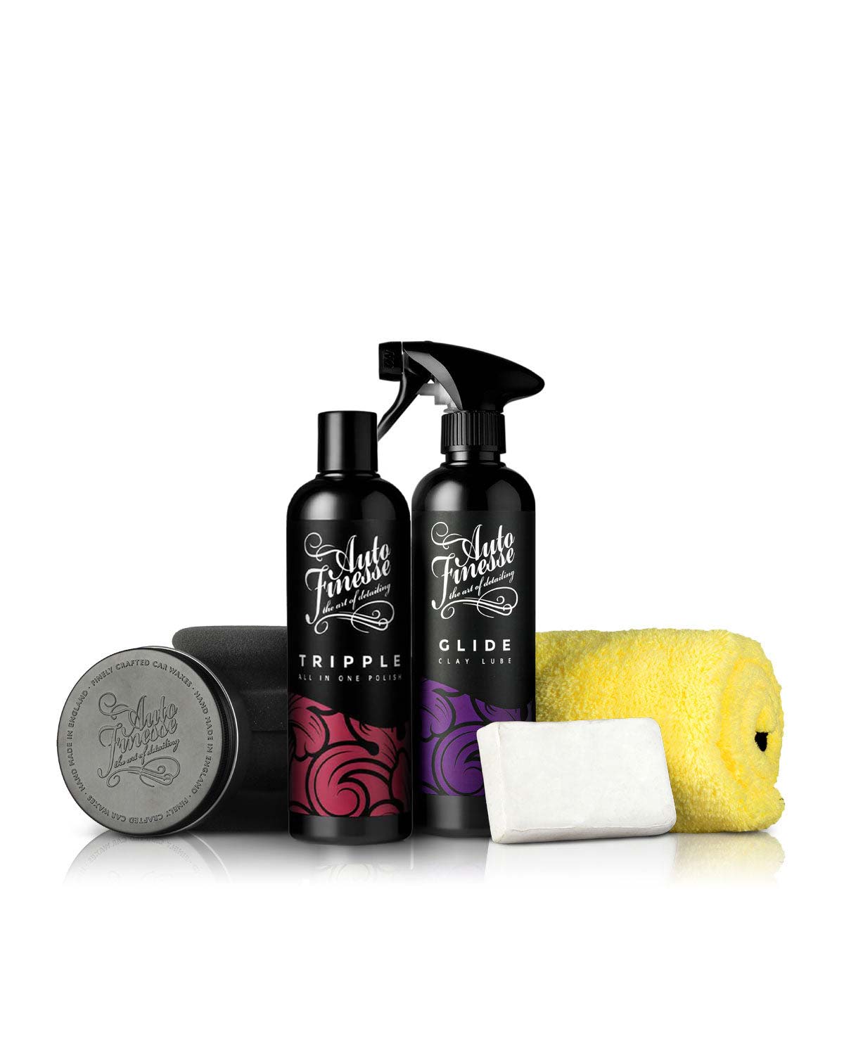 Automotive care products including bottles, a sponge, and a bar on a white background